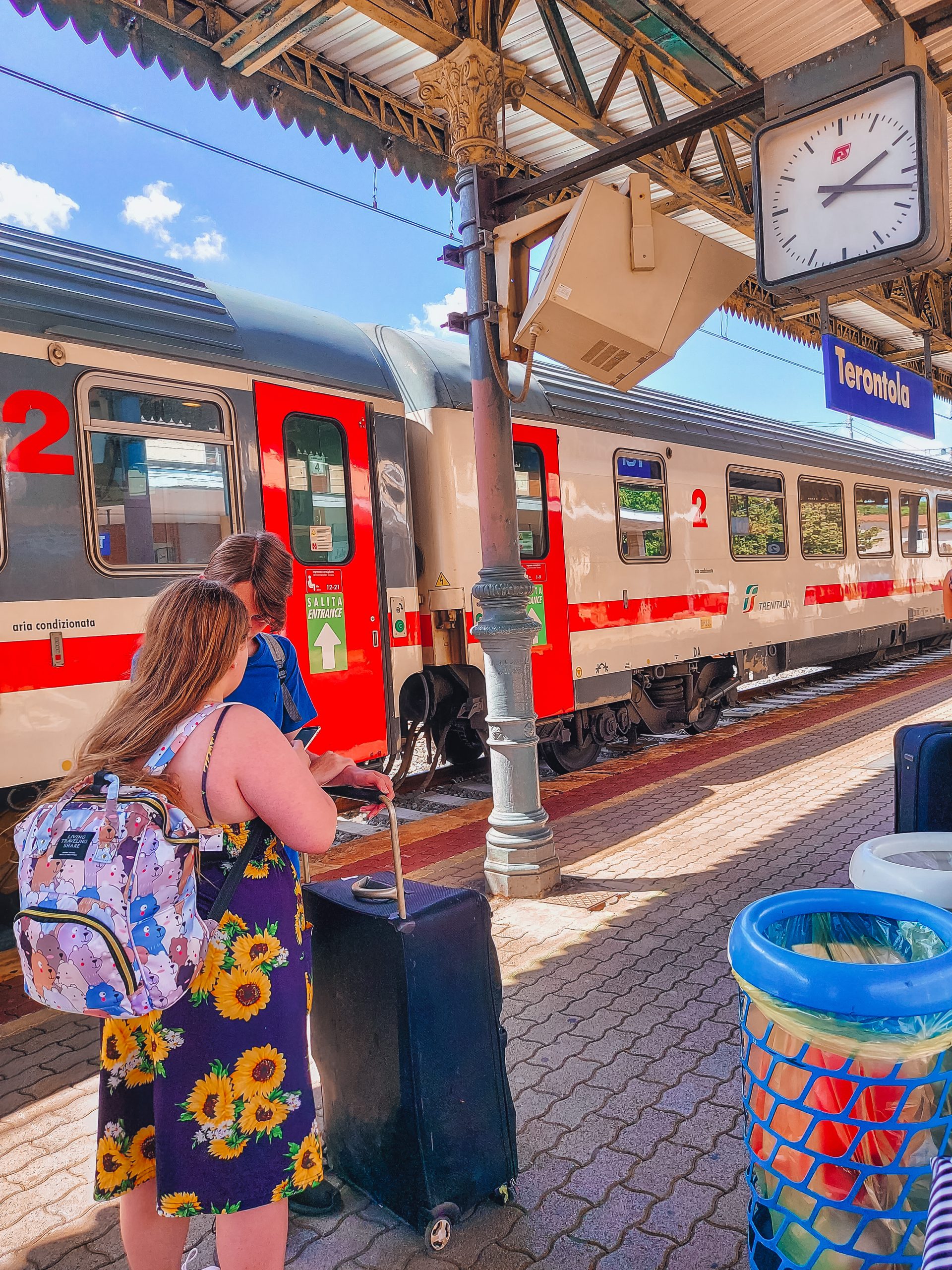 Italian train station with children and luggage