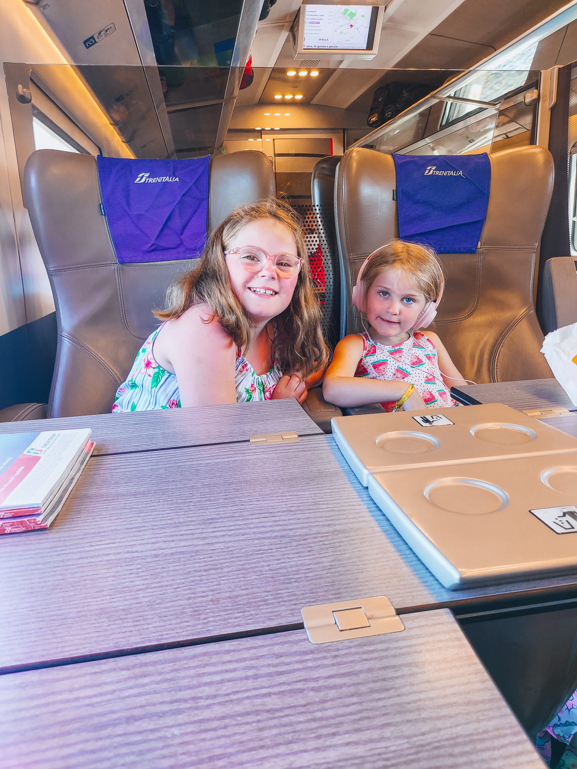 family travelling through Italy by train, showing how you can plan a car-free Italy train itinerary