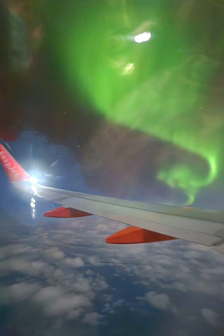 the aurora from iceland northern lights on the plane from Iceland
