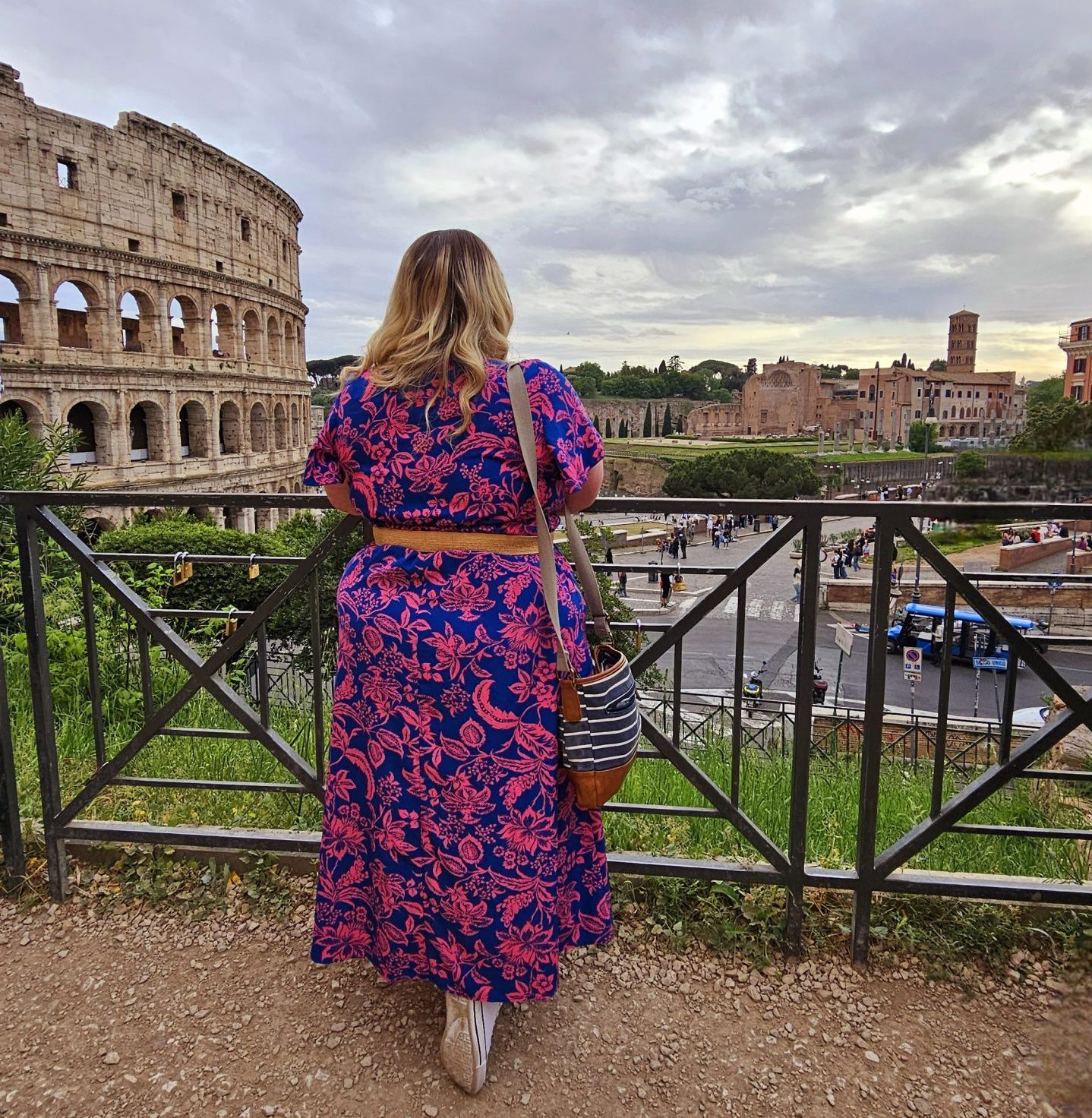 Sarah from Build a Break beside the Colosseum during her Rome extreme day trip and Vespa sidecar tour