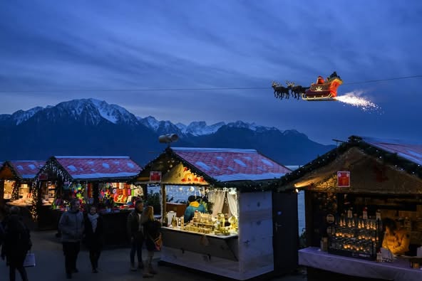 montreux christmas markets santa flying across the sky