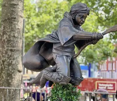 Harry Potter flying on a broomstick statue in Leicester Square London