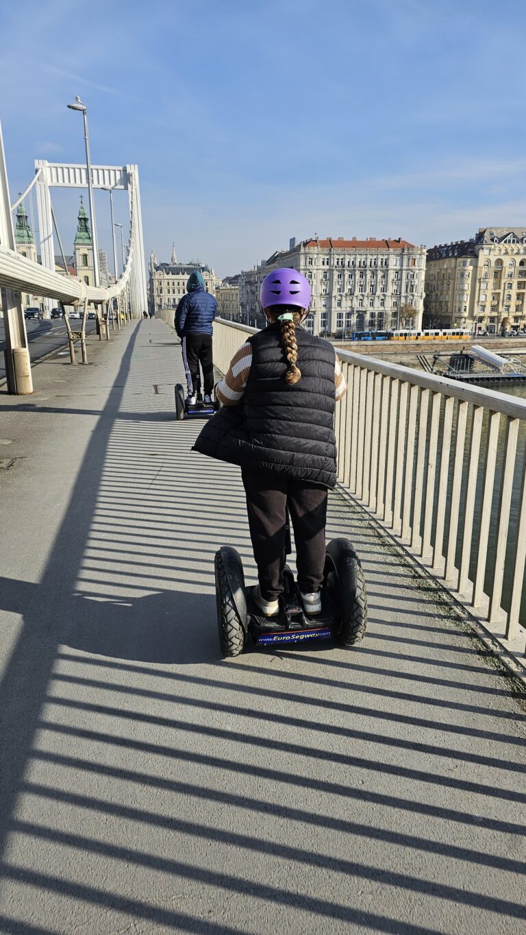 My teenage daughter riding a Segway on Elisabeth Bridge during our Budapest sightseeing tour.